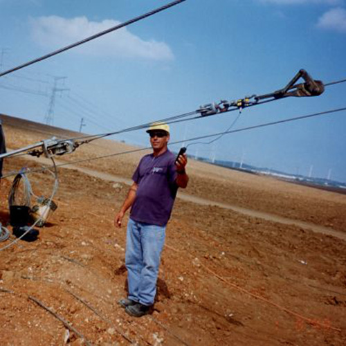 Load on a tension wire is measured by the installer